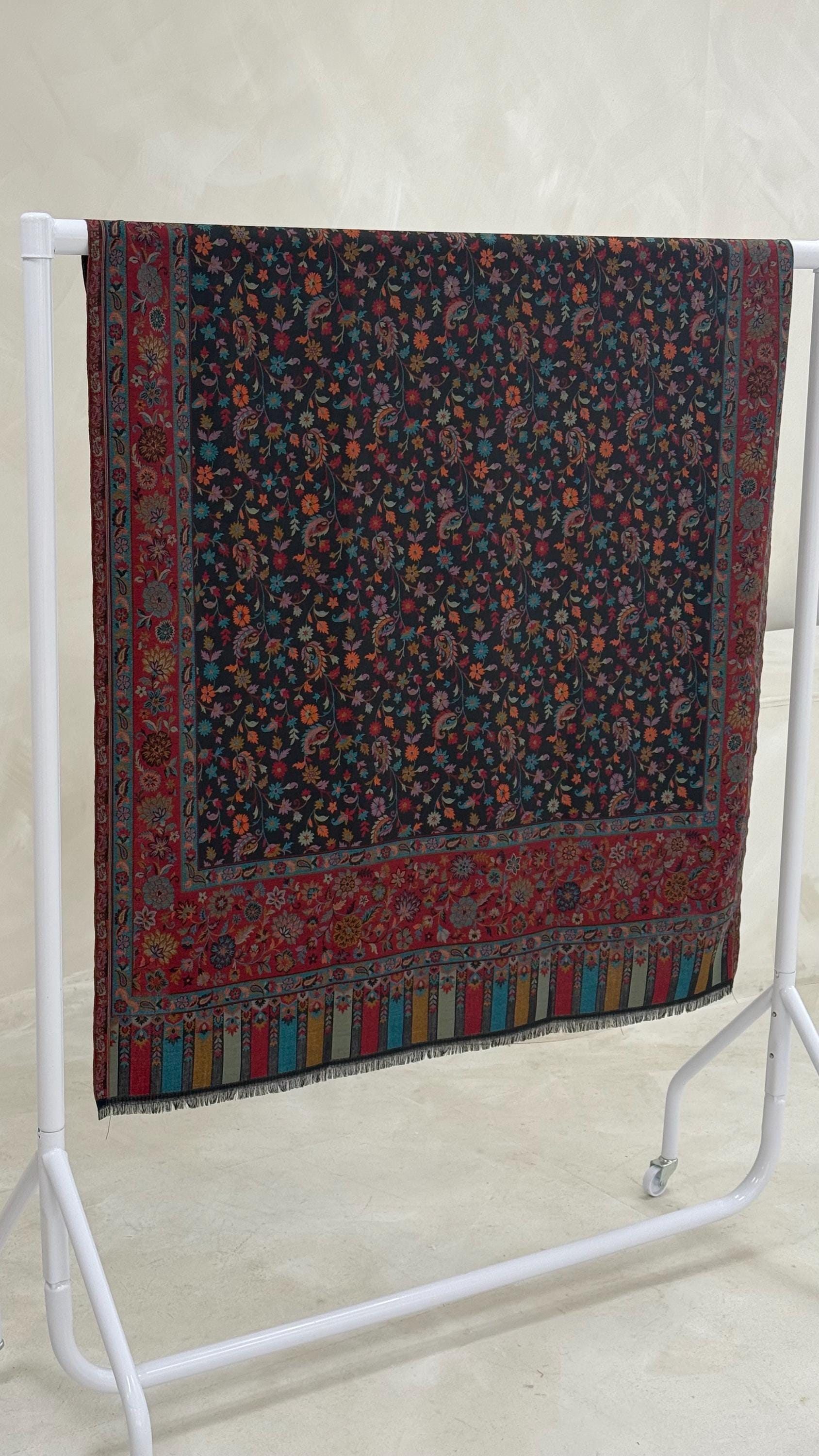 Decorative scarf with a floral pattern on a white stand