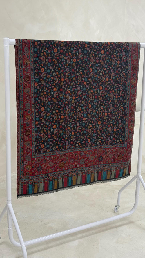 Decorative scarf with a floral pattern on a white stand